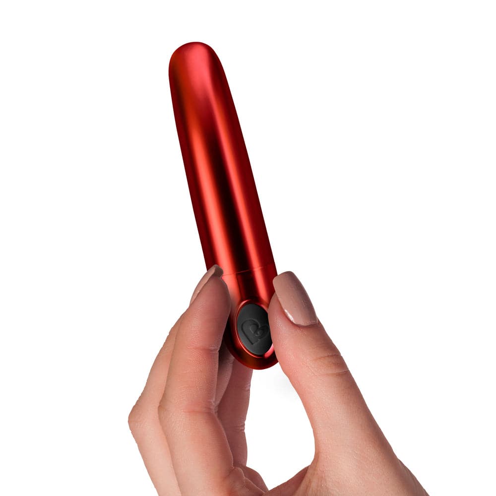 Rocks Off Ruby Caress Vibrator featuring a sleek design with gentle curves and a vibrant red color.