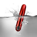 Rocks Off Ruby Caress Vibrator in a sleek, red design with smooth curves and ergonomic shape for comfortable use.