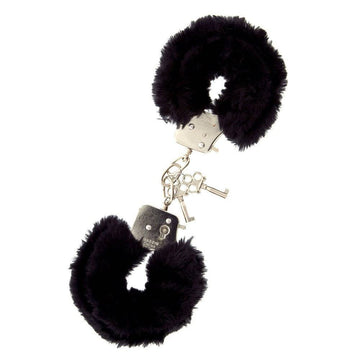 Black metal handcuffs with faux fur by Dream Toys, showcasing a sleek design and soft texture for added comfort.