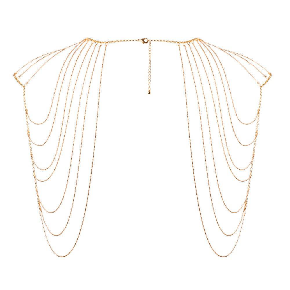 Bijoux Indiscrets Magnifique gold axelsmycke featuring intricate design and elegant detailing on a soft background.