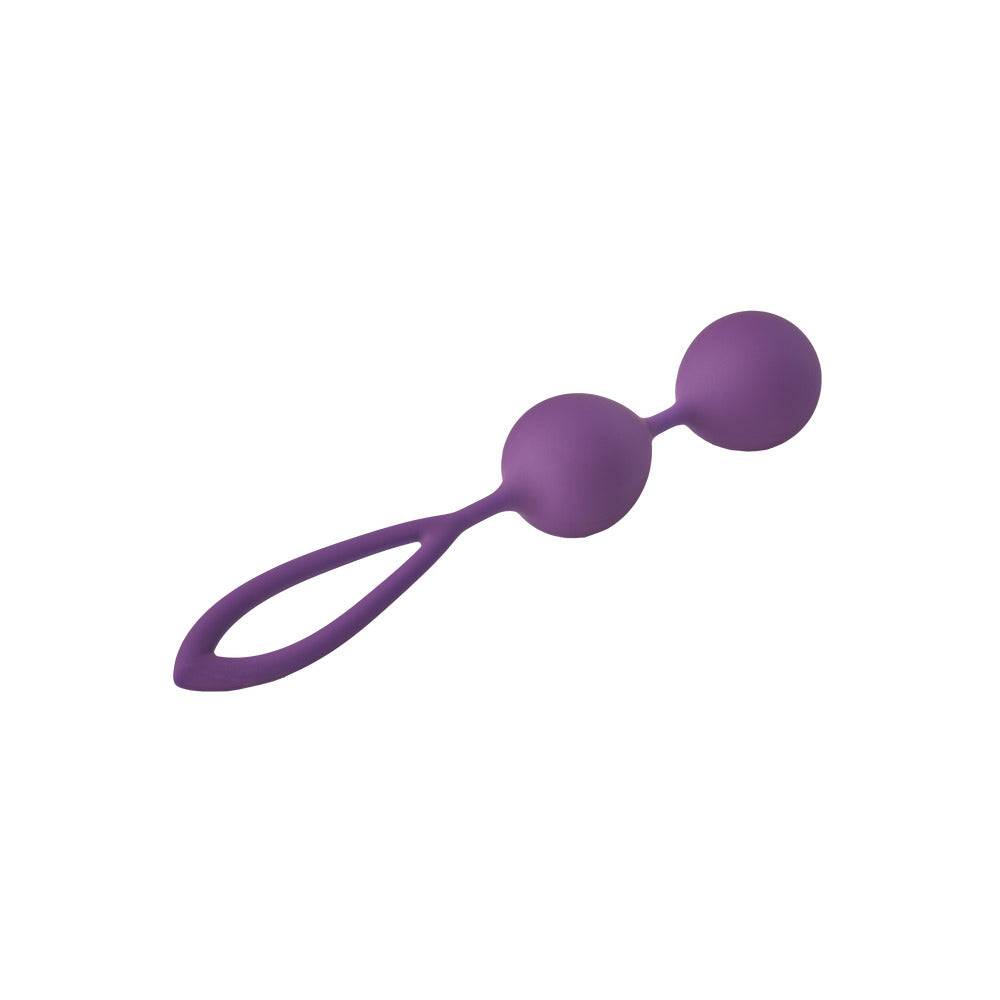 Purple Dream Toys Kegel balls displayed on a soft surface, highlighting their smooth texture and ergonomic design.