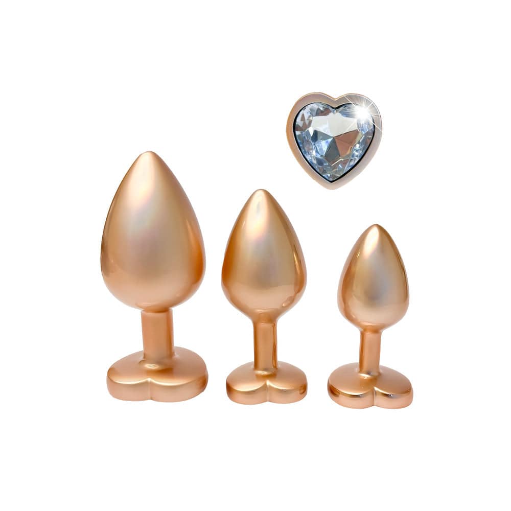 Dream Toys Gleaming Love Pearl Gold Butt Plug Set featuring elegant gold design and smooth pearl finish.