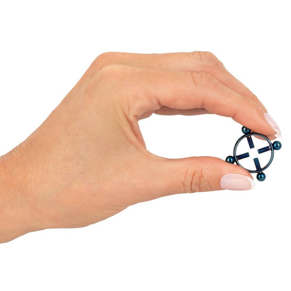 Bad Kitty Blue Moon nipple jewelry featuring a delicate design with blue accents and intricate metal detailing.