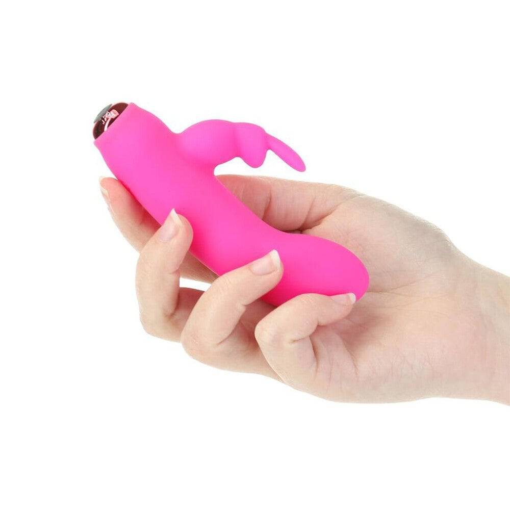 PowerBullet Alices Bunny silicone rechargeable rabbit vibrator in soft pink with curved design and textured surface.