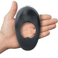 Hot Octopuss Atom Plus vibrating cock ring in sleek black design, showcasing its unique shape and textured surface.