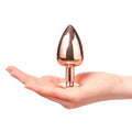 Large rose gold Dorcel Diamond butt plug with a sleek design and gemstone accent, displayed against a neutral background.