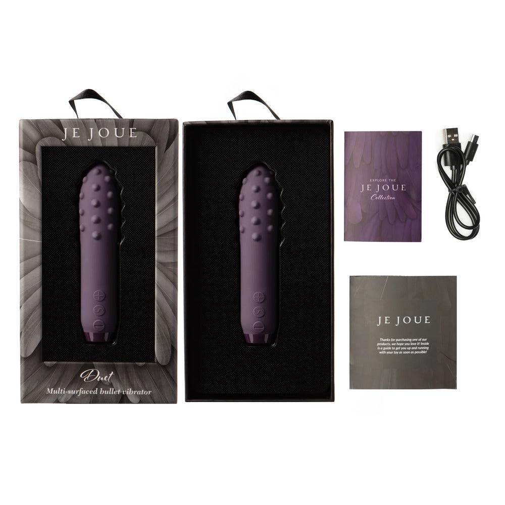 Je Joue Duet multi-surfaced bullet vibrator in a vibrant lila color, showcasing its sleek design and textured surfaces.