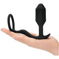 B-Vibe Snug And Tug anal plug and cock ring set in black, showcasing smooth silicone design and adjustable features.