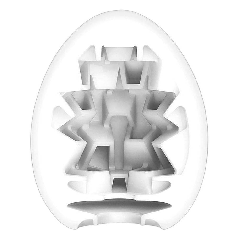 Tenga Boxy Egg Masturbator with unique texture design in a sleek, egg-shaped case for discreet storage and use.