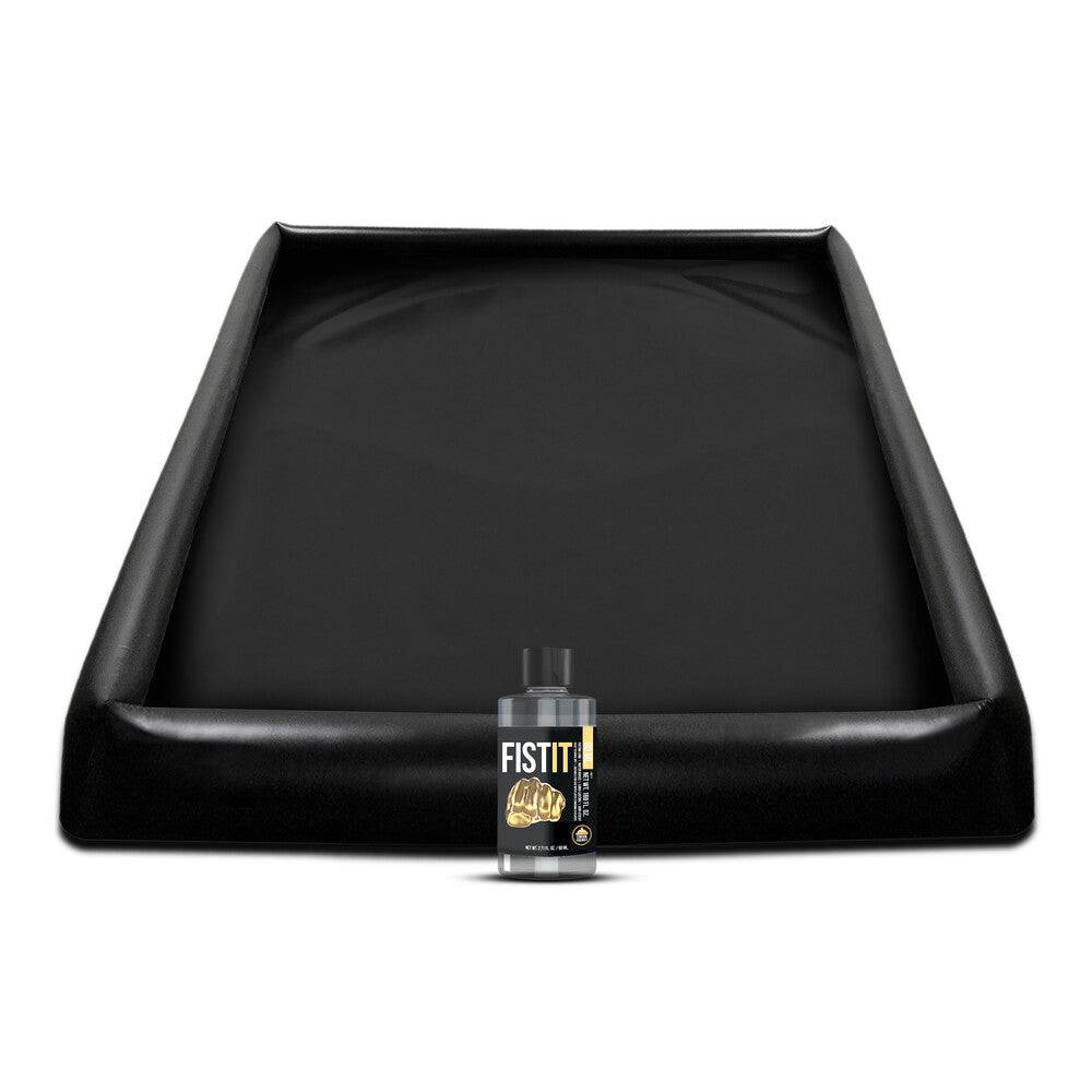 Shots Toys Fist It inflatable toy blanket and lubricant, featuring a sleek black design for enhanced play.