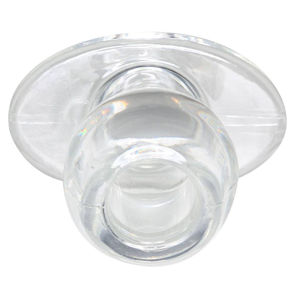 Medium clear tunnel plug by Perfect Fit, showcasing a smooth, transparent design for comfortable wear.