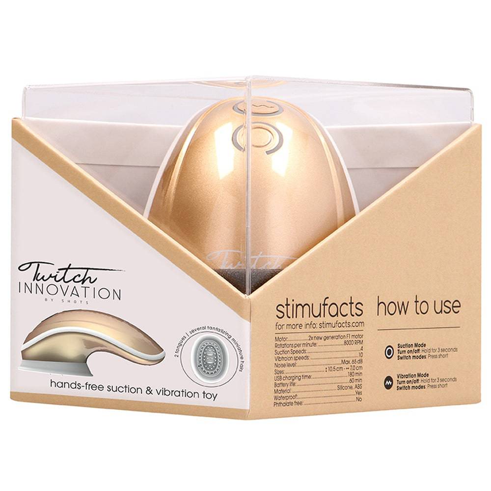 Gold hands-free vibrator toy by Shots Toys with a sleek design and textured surface for enhanced pleasure.