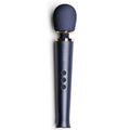 Le Wand Petite rechargeable vibrating massager in navy blue, featuring a sleek design and ergonomic handle.