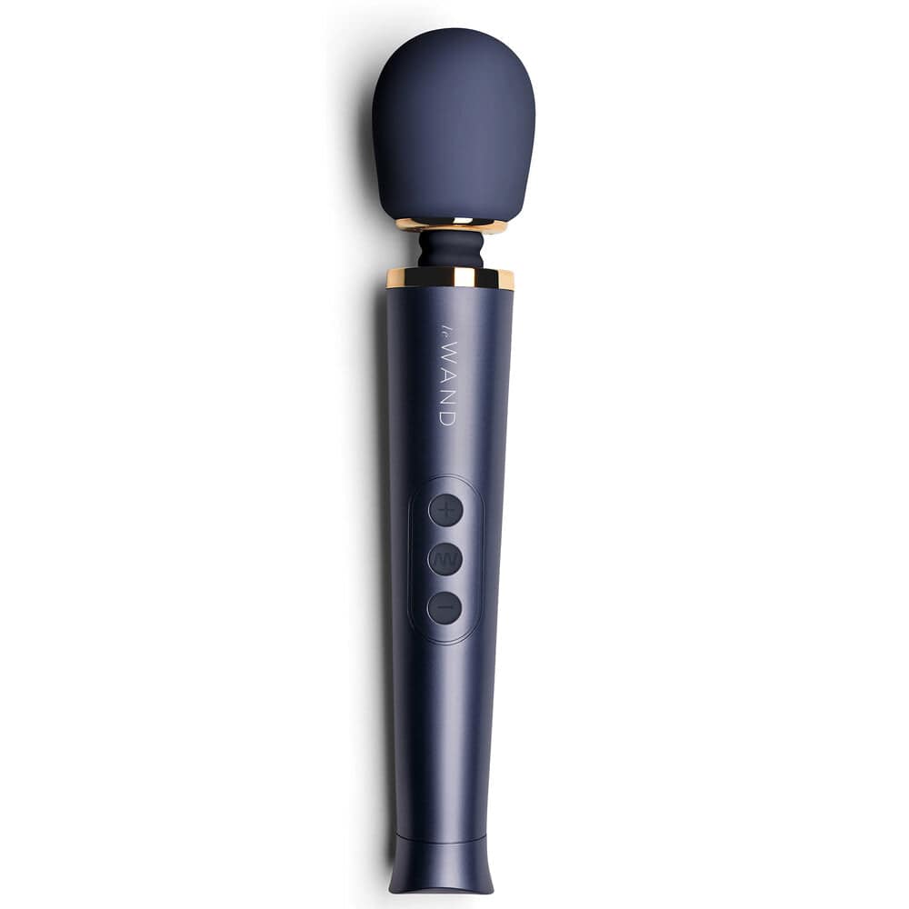 Le Wand Petite rechargeable vibrating massager in navy blue, featuring a sleek design and ergonomic handle.