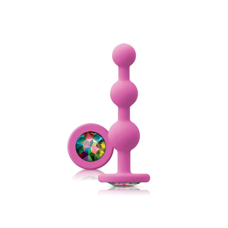 NS Novelties pink ripple anal plug with rainbow gem, showcasing a smooth design and vibrant colors.