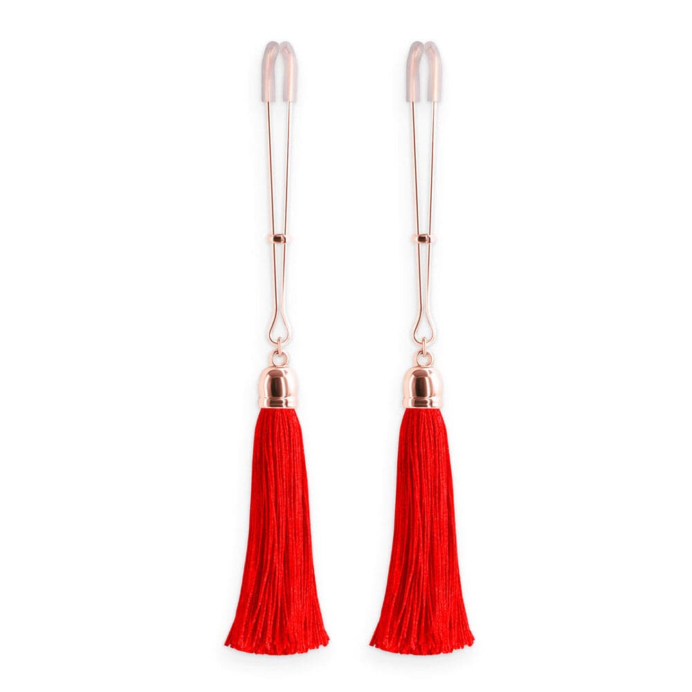 Red tassel nipple clamps by NS Novelties, featuring adjustable tension and a stylish, playful design.