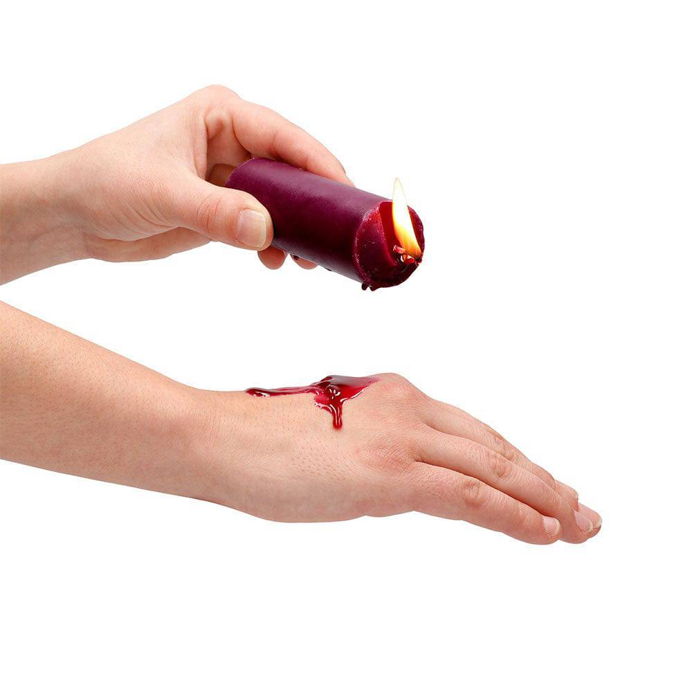 Rose-scented Ouch Wax Play Candle by Shots Toys, featuring a decorative design for sensory experiences.