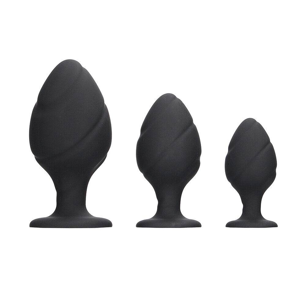 Black silicone swirled butt plug set from Shots Toys, featuring smooth curves and a tapered design for comfort.