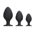 Black silicone swirled butt plug set from Shots Toys, featuring smooth curves and a tapered design for comfort.
