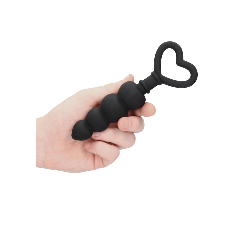 Black silicone anal beads by Shots Toys, featuring a smooth design and flexible structure for comfortable use.