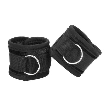 Shots Toys Ouch handcuffs in soft velvet with velcro straps, featuring a sleek black design for comfortable restraint.