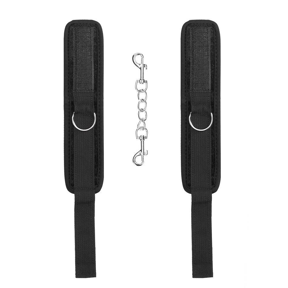 Shots Toys velvet handled cuffs with Velcro straps, featuring a sleek black design for comfortable restraint.