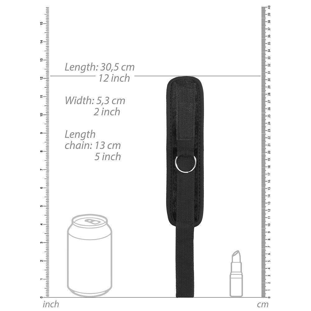 Shots Toys velvet bondage cuffs with handle and velcro straps in black, showcasing soft material and secure design.