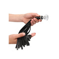 Shots Toys Ouch flogger with diamond studs, featuring multiple soft tails and a sleek black design.