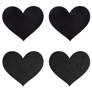 Black heart-shaped Peekaboos pasties on a soft surface, featuring a smooth finish and elegant design.