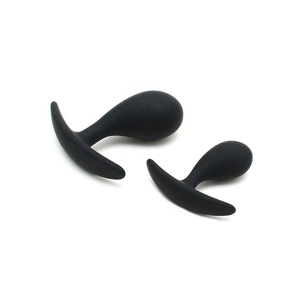 Copenhagen Black Duo Anal Plug Set by Rimba featuring two sleek, black silicone plugs of varying sizes.