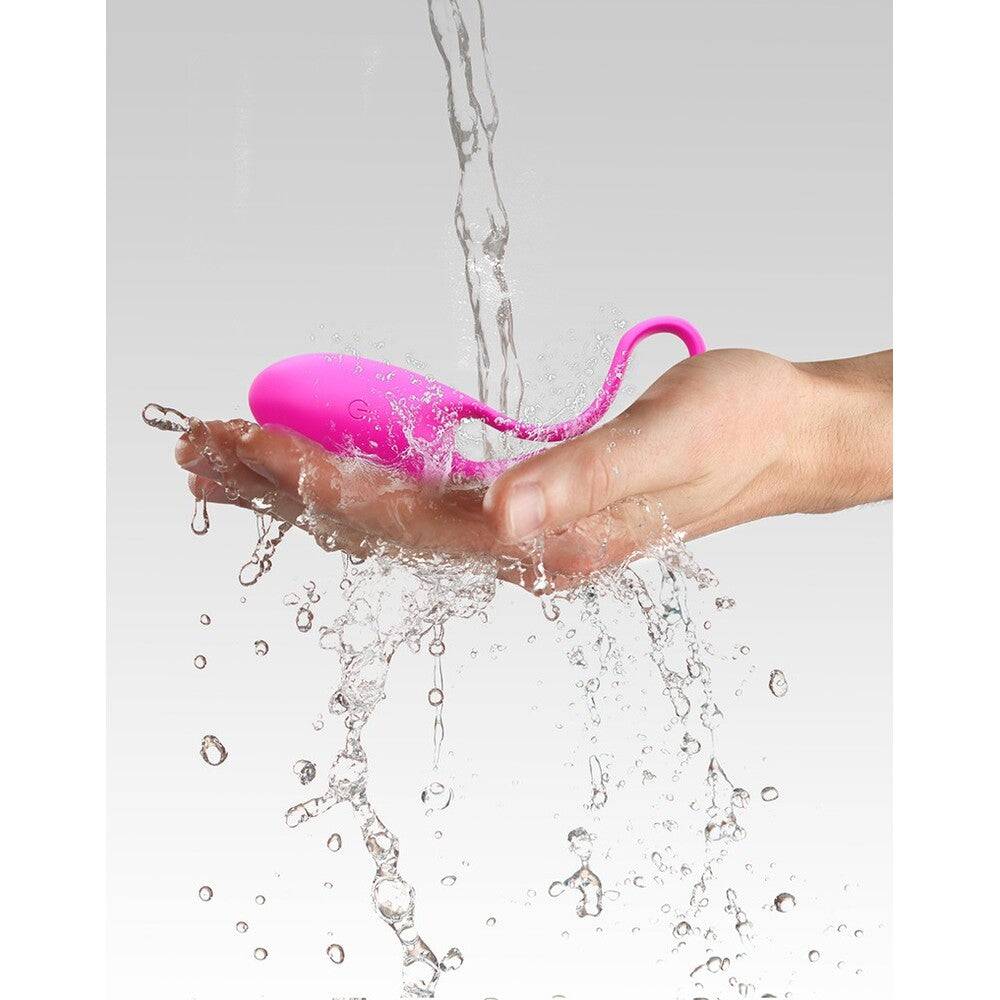 Love To Love remote-controlled egg in vibrant pink, showcasing sleek design and user-friendly controls.