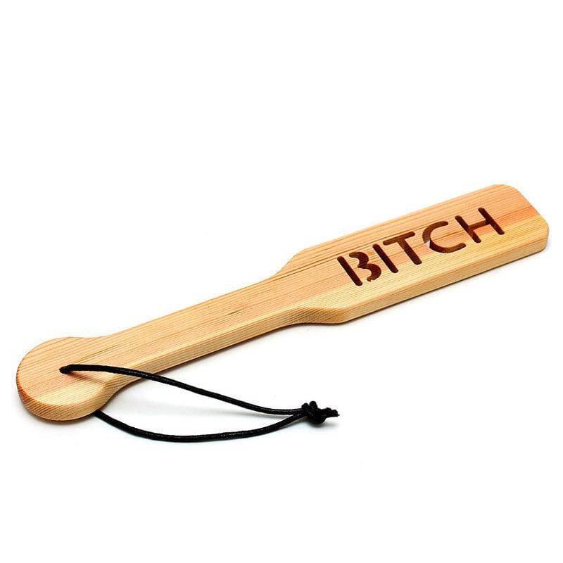 Rimba wooden paddle with smooth finish and sturdy handle, designed for impact play in BDSM activities.
