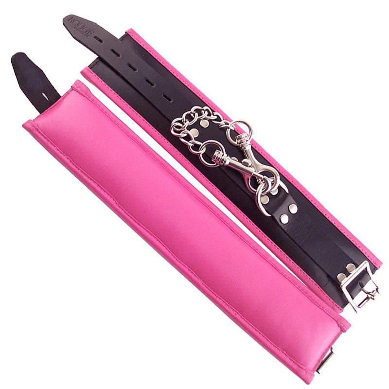 Rouge Garments padded ankle cuffs in pink with decorative trim, featuring a soft fabric and stylish design.