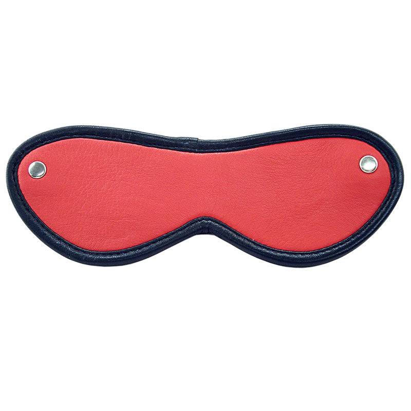 Red eye mask from Rouge Garments, featuring a soft fabric design, ideal for relaxation and sleep.