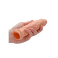 Realrock 6-inch flesh pink penis sleeve by Shots Toys, featuring a realistic texture and design for enhanced pleasure.