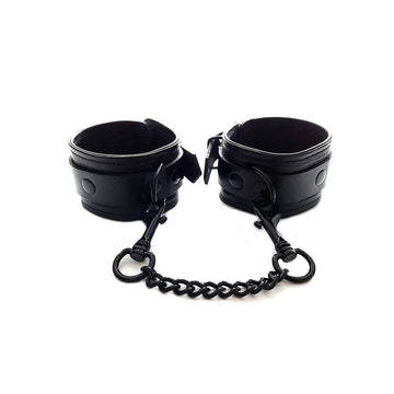 Rouge Garments black ankle cuffs displayed on a white background, featuring a sleek, minimalist design.