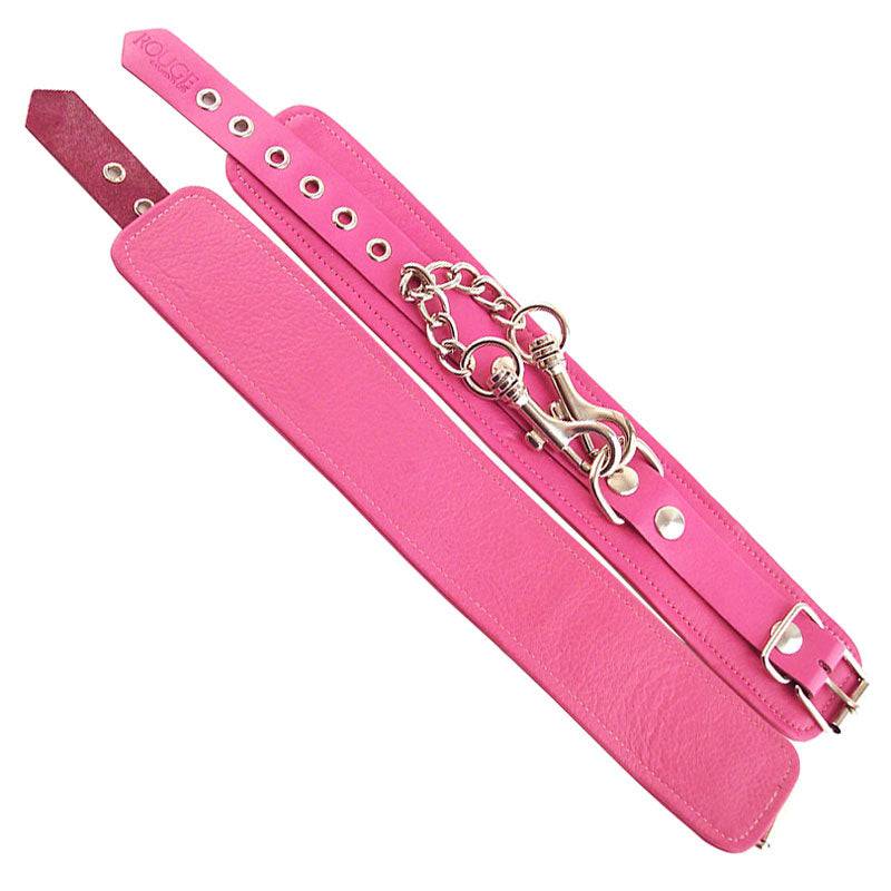 Pink ankle cuffs by Rouge Garments with a soft fabric and stylish design, perfect for adding flair to any outfit.
