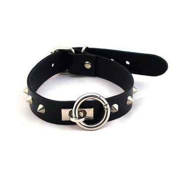 Black ORing collar with studs from Rouge Garments, featuring a sleek design and edgy style.