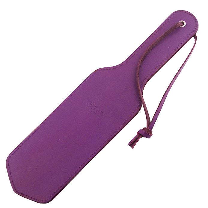 Rouge Garments Lila paddle in purple, showcasing its sleek design and smooth finish against a neutral background.