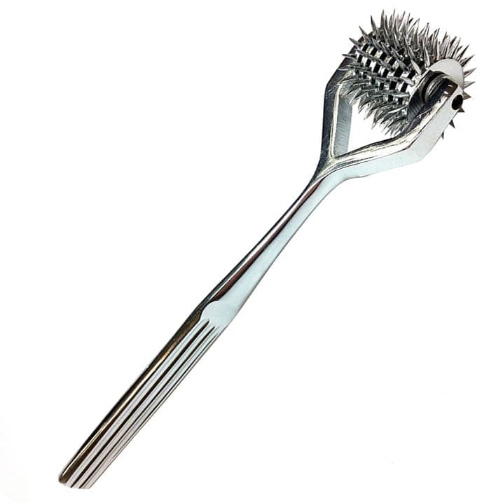 Rouge Garments 7-wheel stainless steel wheel pin set on a neutral background, showcasing the sleek design and craftsmanship.