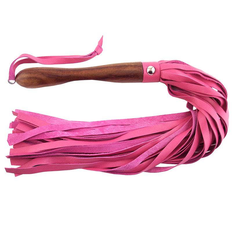 Rouge Garments pink leather flogger with a wooden handle, showcasing intricate detailing and craftsmanship.