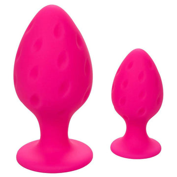 California Exotic Cheeky Butt Plug Duo in pink, featuring two different sizes with smooth, rounded shapes.