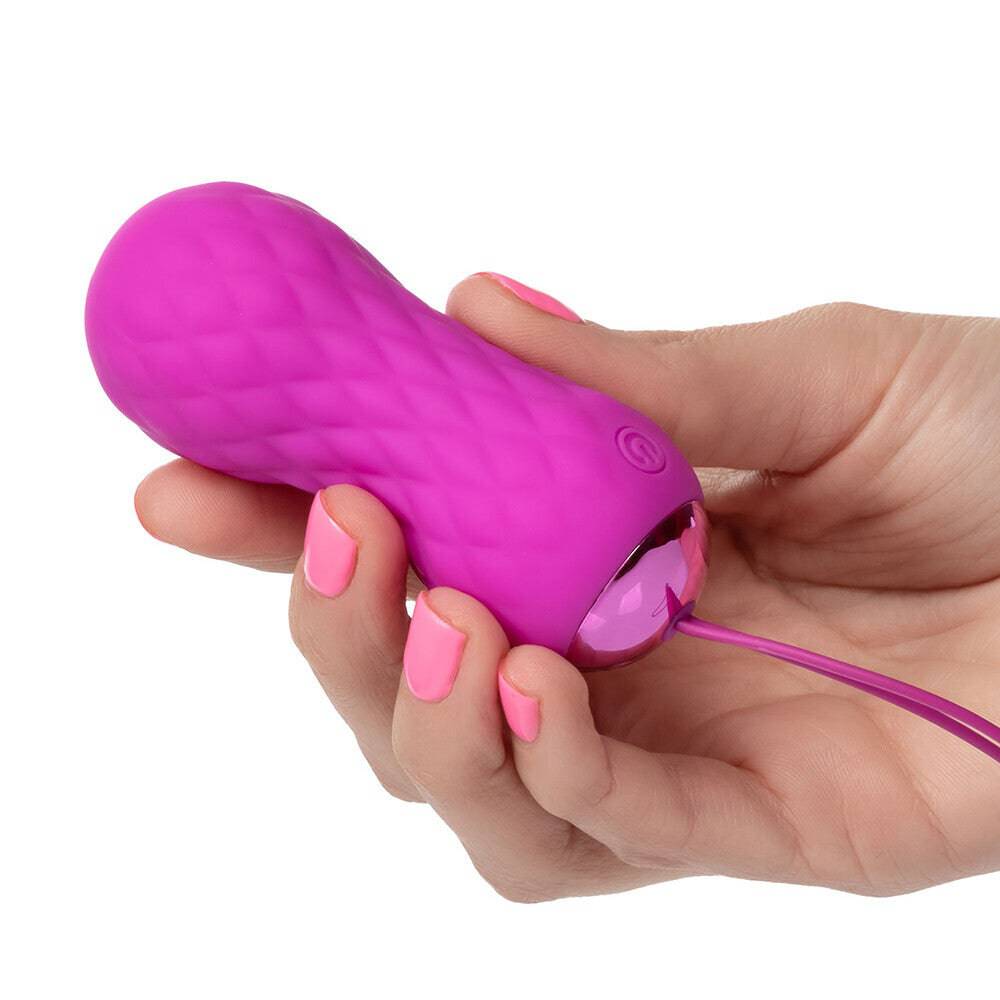 California Exotic Slay SPINME textured remote control ball in vibrant colors, showcasing unique design and ergonomic shape.