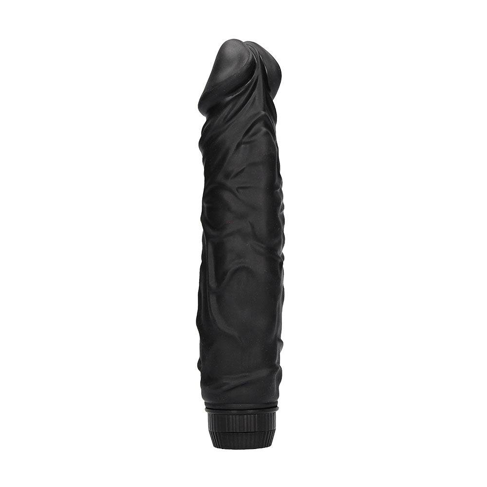 Black realistic vibrator by Shots Toys, featuring a lifelike design and textured surface for enhanced pleasure.