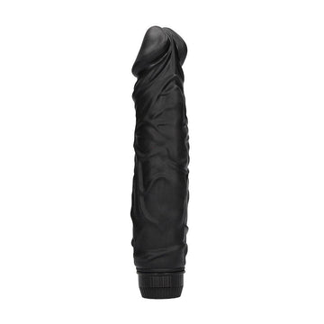 Black realistic vibrator by Shots Toys, featuring a lifelike design and textured surface for enhanced pleasure.