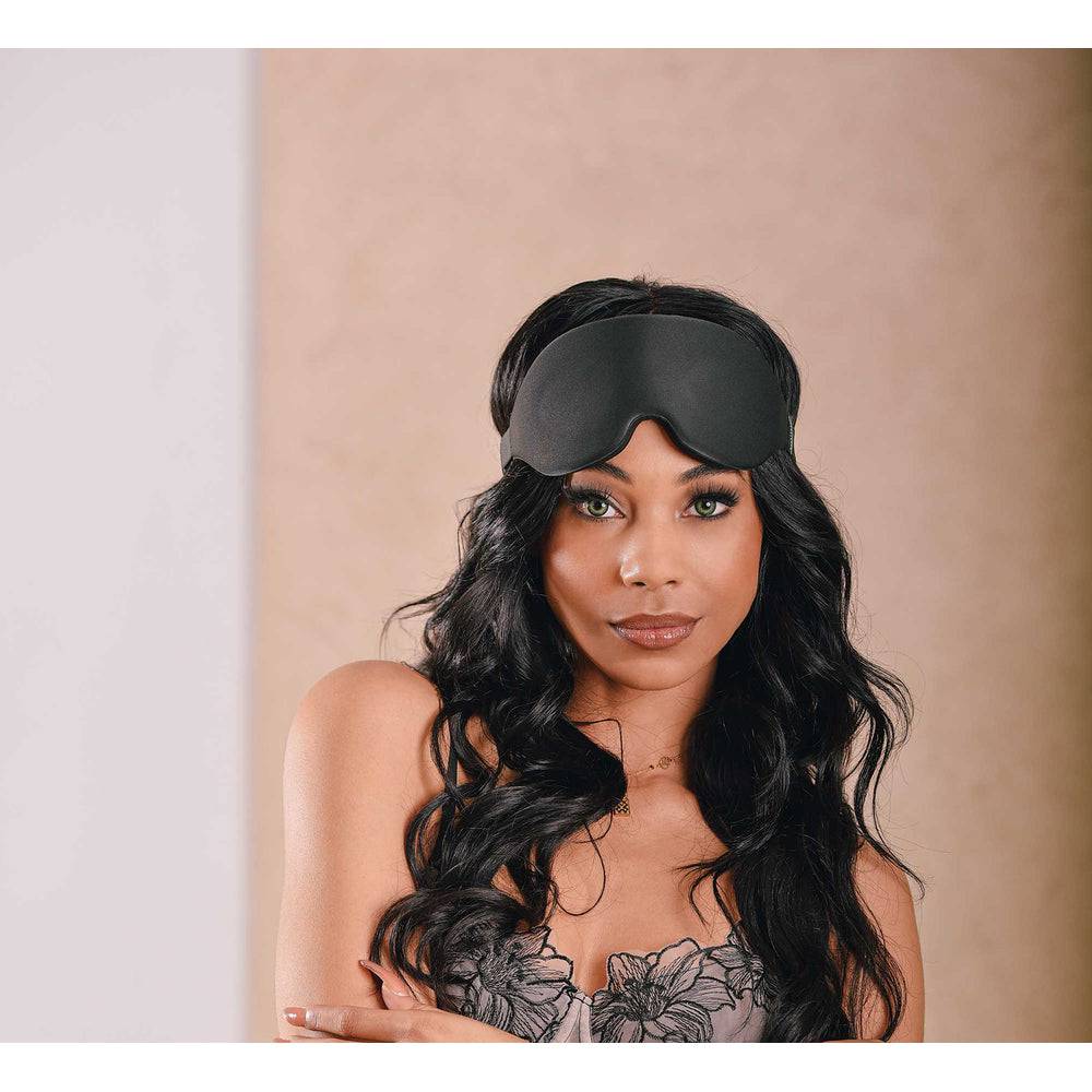 Sportsheets Blackout eye mask, soft black fabric, adjustable strap, designed for complete light blockage and comfort.