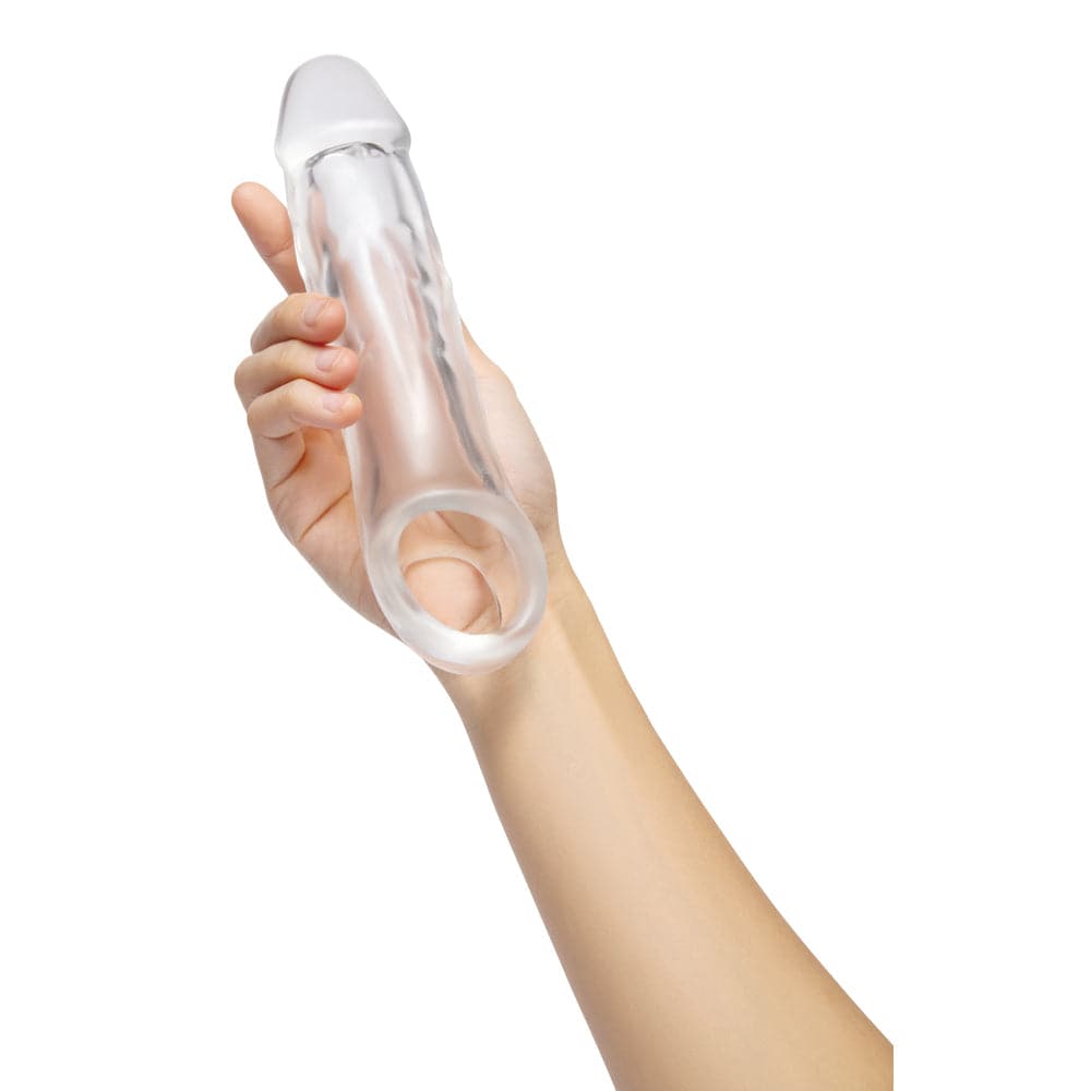 Size Up Clear Penis 2 tum förlängare, showcasing a transparent design with flexible material for comfort and enhancement.