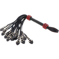 Hidden Desire CatoNine whip made of leather with intricate detailing and a comfortable grip, ideal for playful experiences.