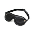 Rimba padded eye mask in black, featuring a soft texture and adjustable strap for comfort during sleep or relaxation.