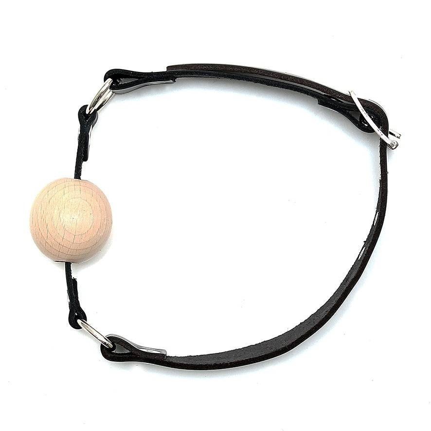Rimba leather gag with wooden ball, featuring a durable strap and adjustable design for comfortable wear.